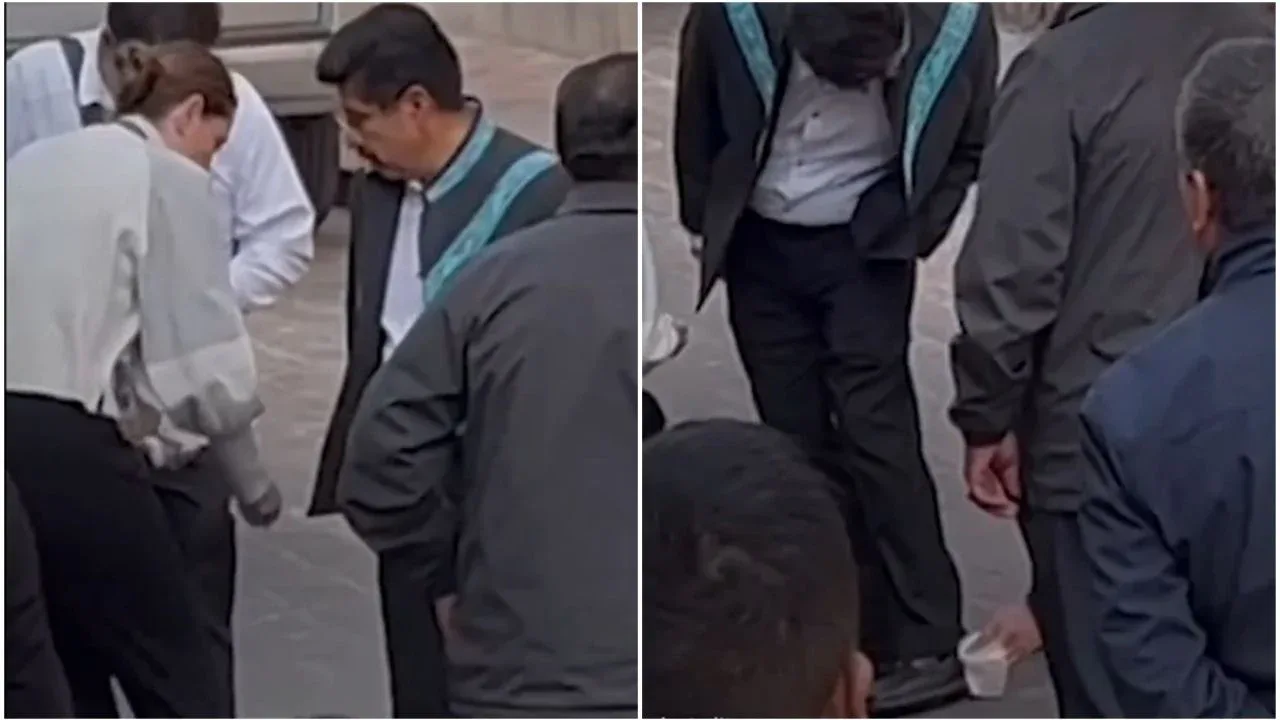 Amanda Pérez limpiando los zapatos del ministro Hugo Aguilar en Querétaro.