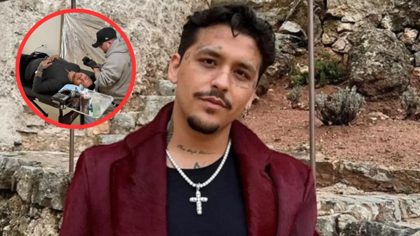 Christian Nodal muestra su nuevo tatuaje en el cuello en una sesión reciente.