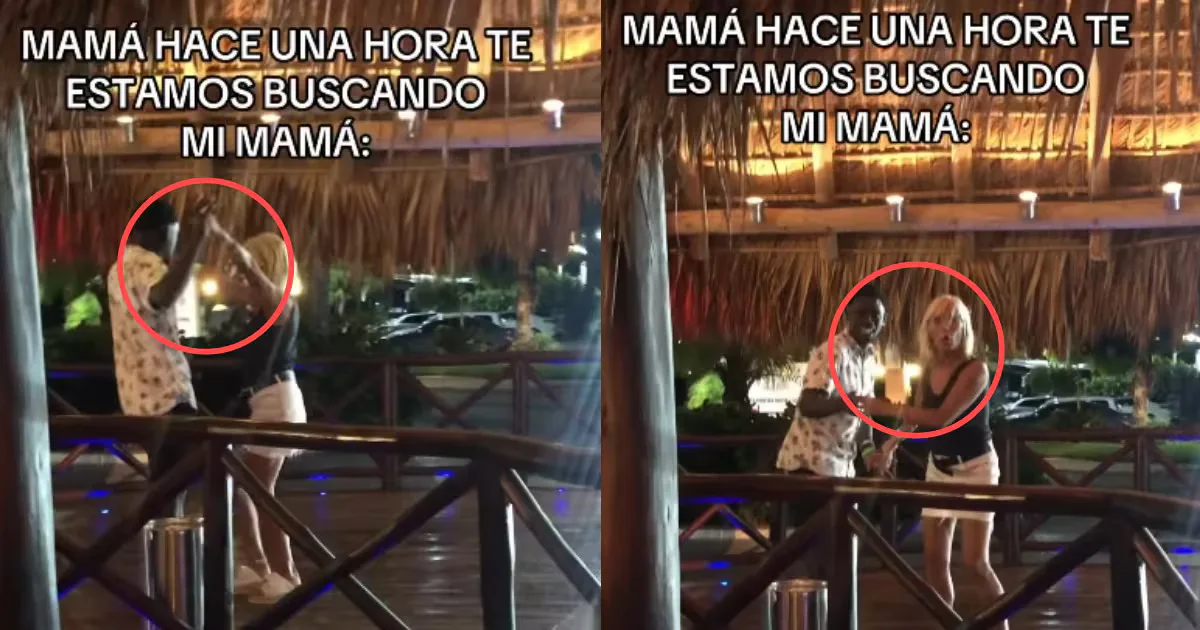 Madre disfrutando de un momento divertido en un restaurante durante sus vacaciones.